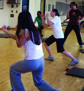 Fitness instructor Nelson Bolarinho teaches women how to use basic boxing techniques to build confidence and upper-body strength at the athletic centre. Photo by Andrea Iseman.
